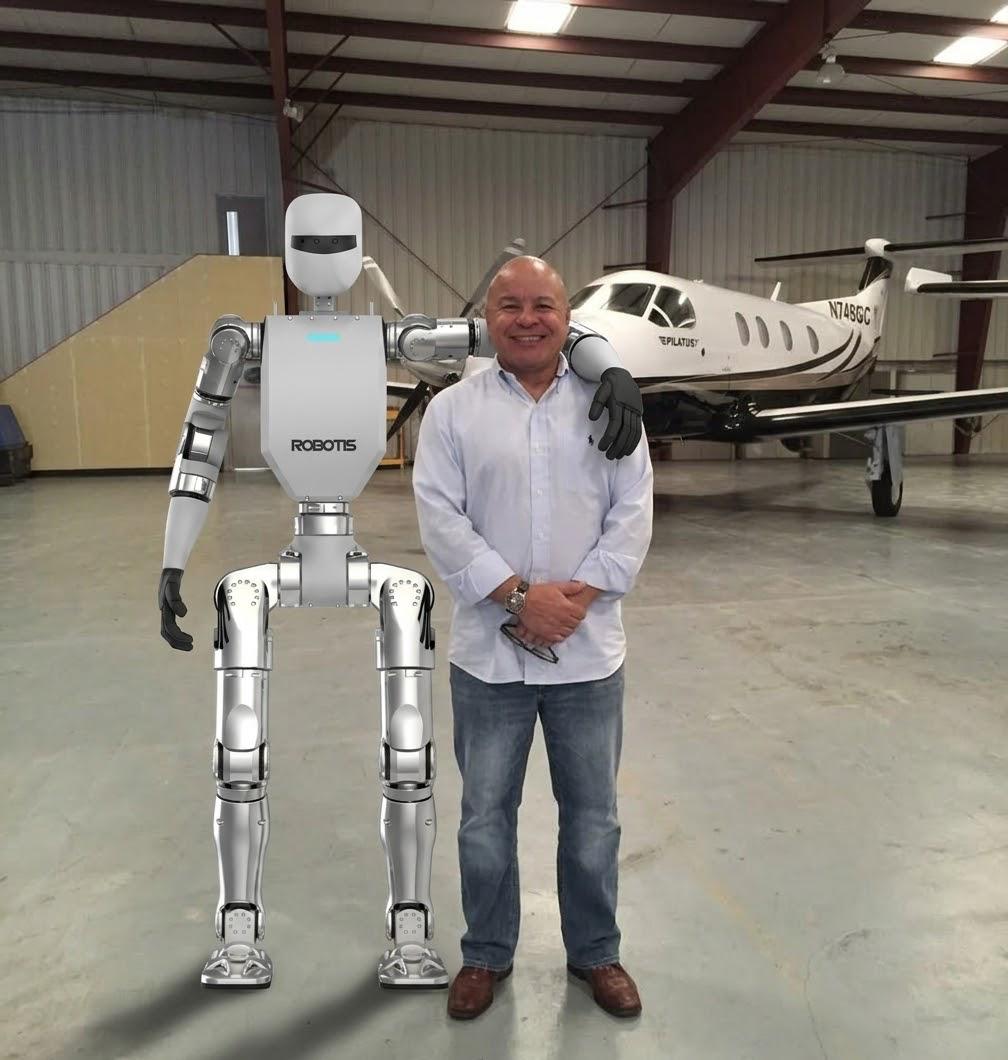 Dr. Armando Guevara, PhD with humanoid robot